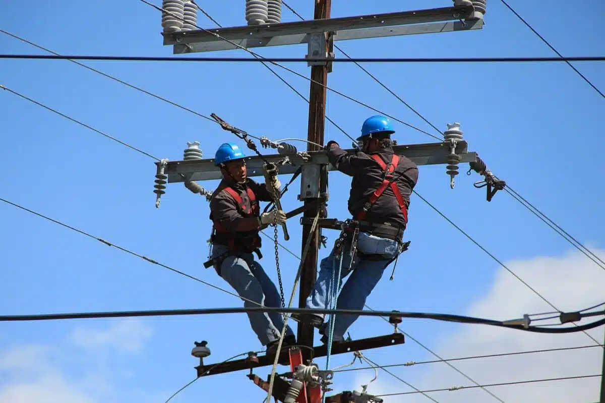 Men working on electric pole